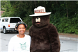 Women poses with Smokey the Bear 2017