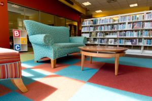 Inside Community Library with Books, Couch and a table