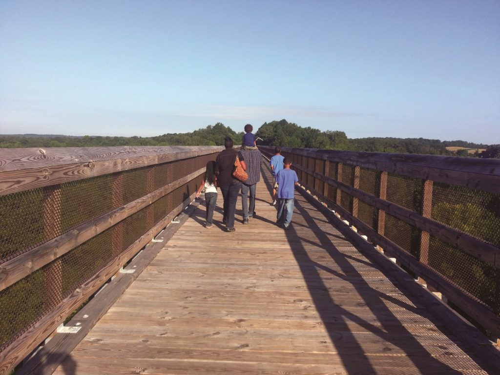 Family walking on bridge