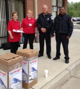Four members of the Drug Take Back Program at an event