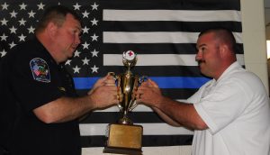Farmville Fire Department and Farmville Policemen hold an award